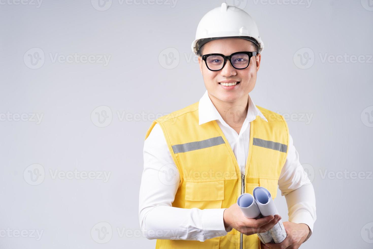 Image of Asian engineer with smiling on gray background photo