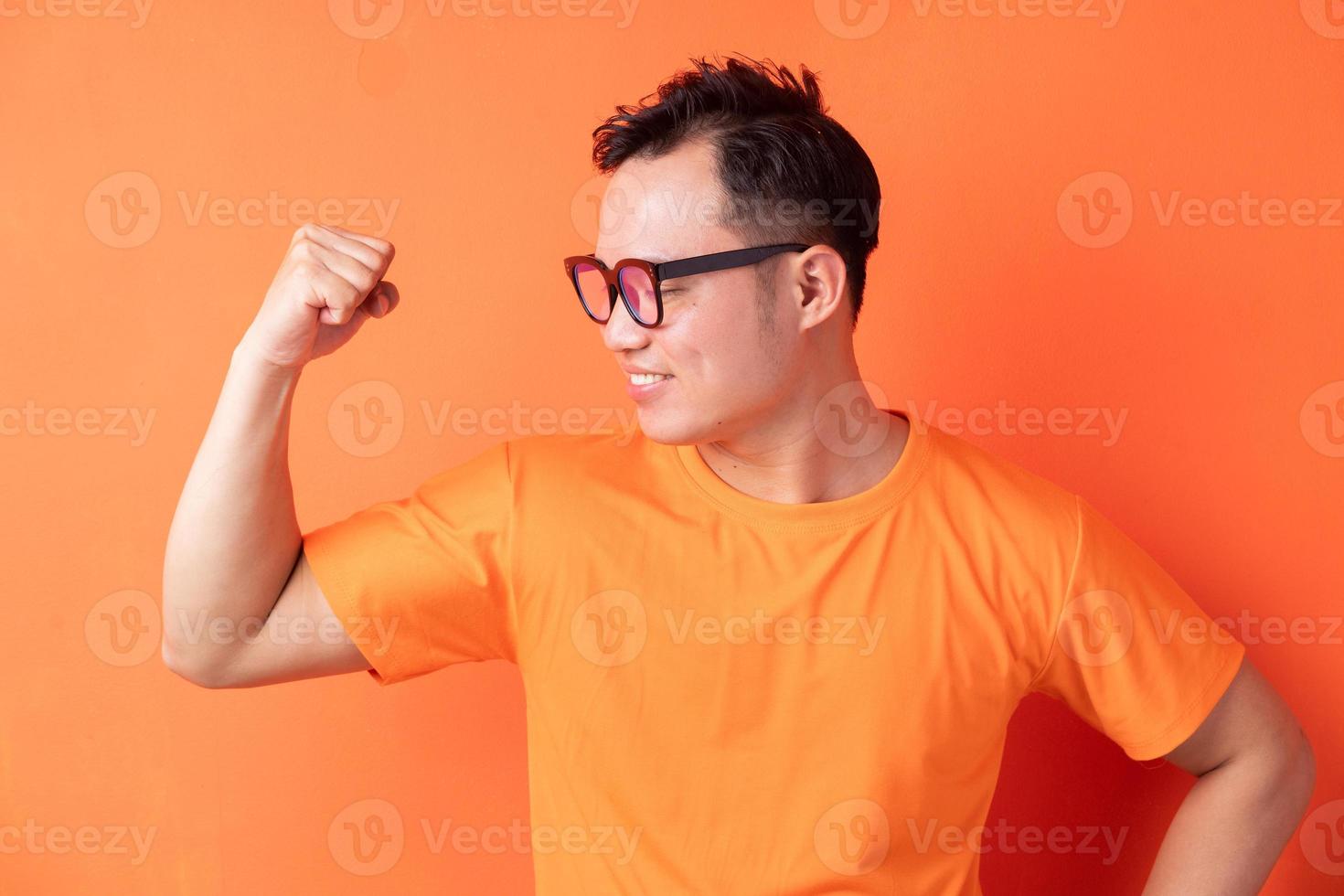 Asian man showing off his muscles photo