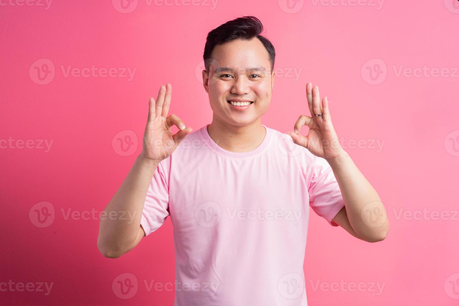 Asian man use ok hand photo