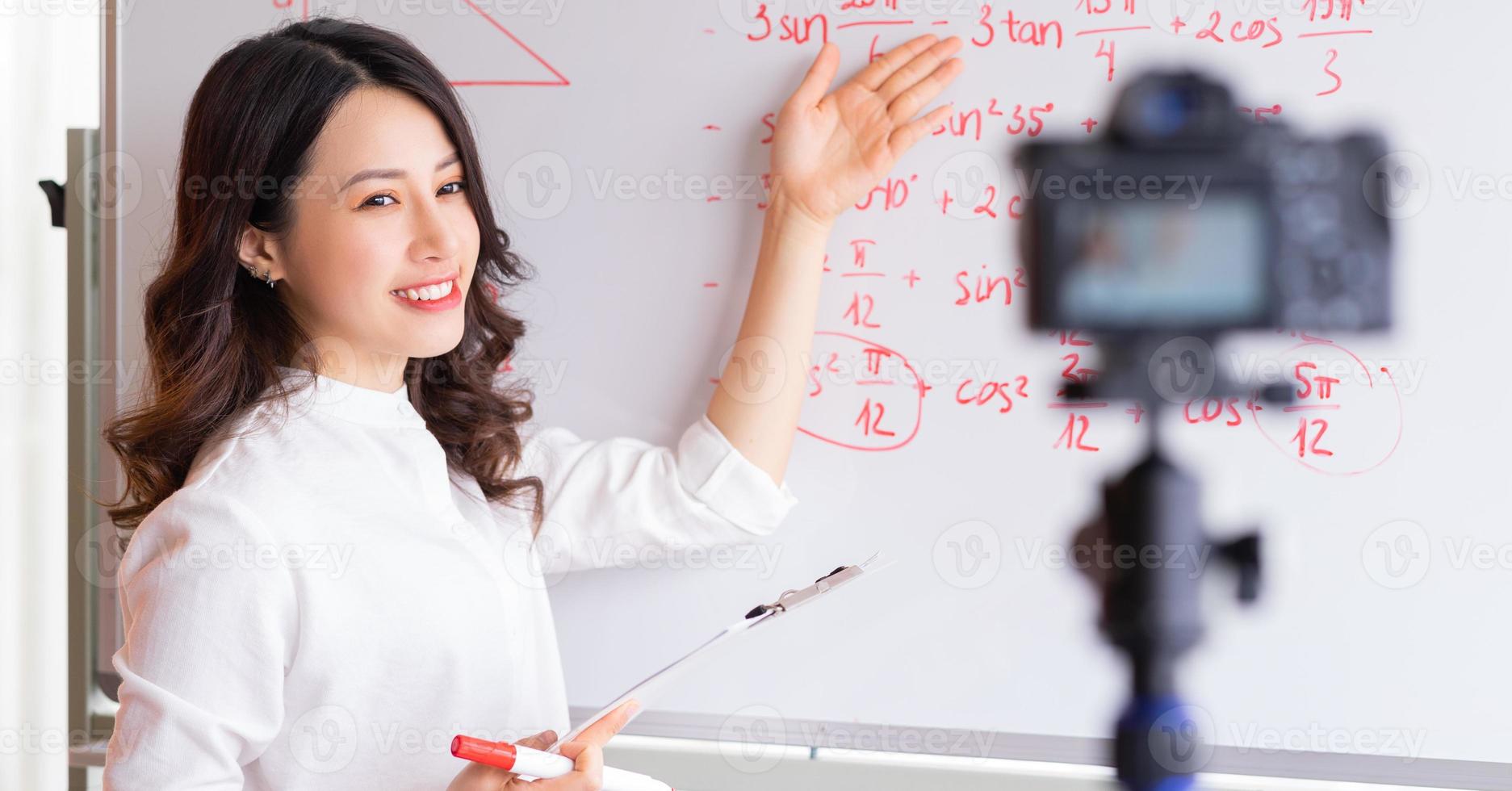 Asian female teachers are recording lessons for online teaching work photo