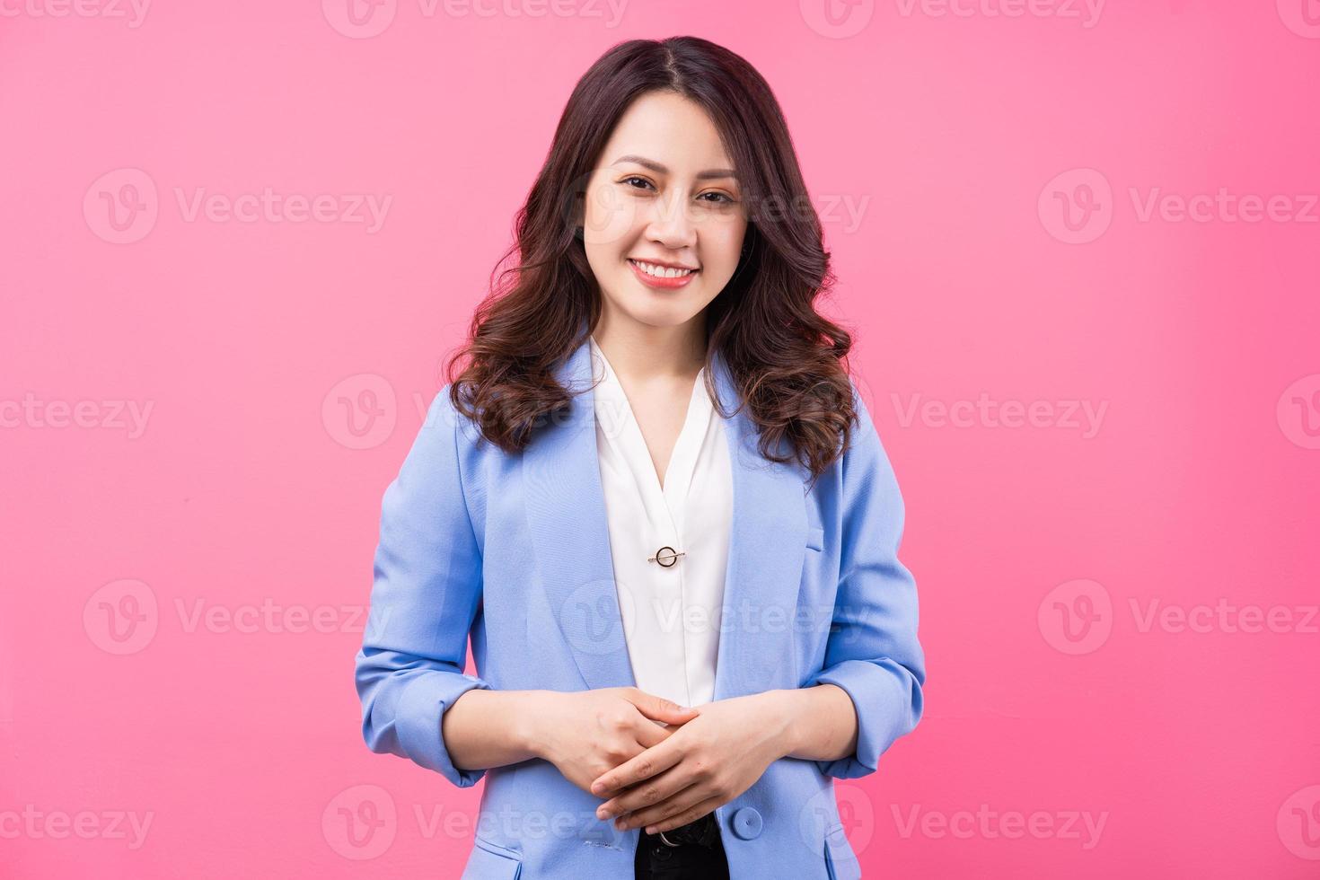Image of Asian businesswoman on pink bakcground photo