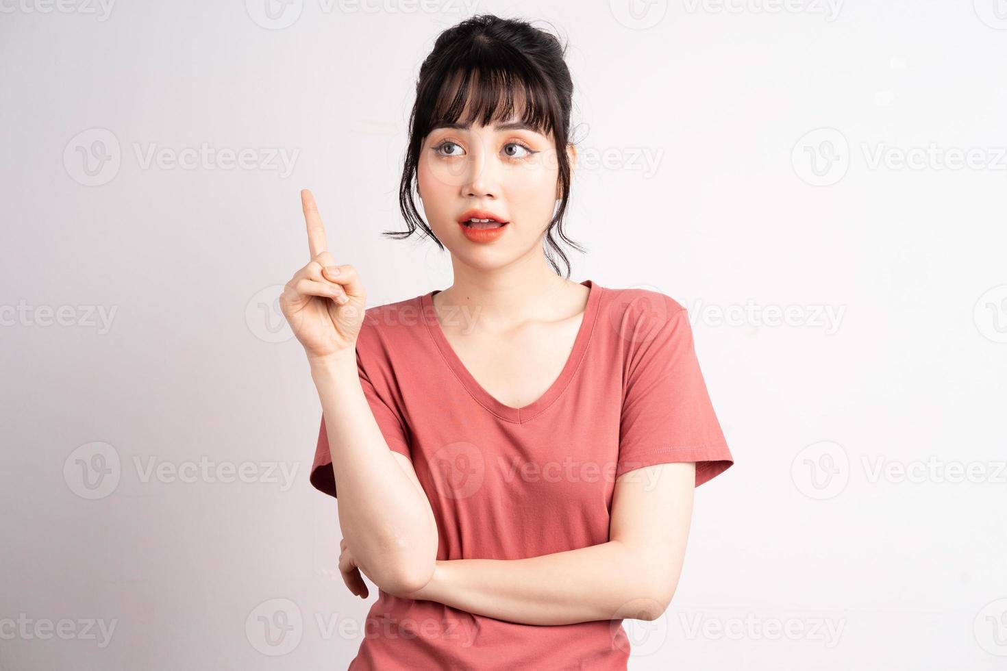 Young Asian woman posing on white background photo