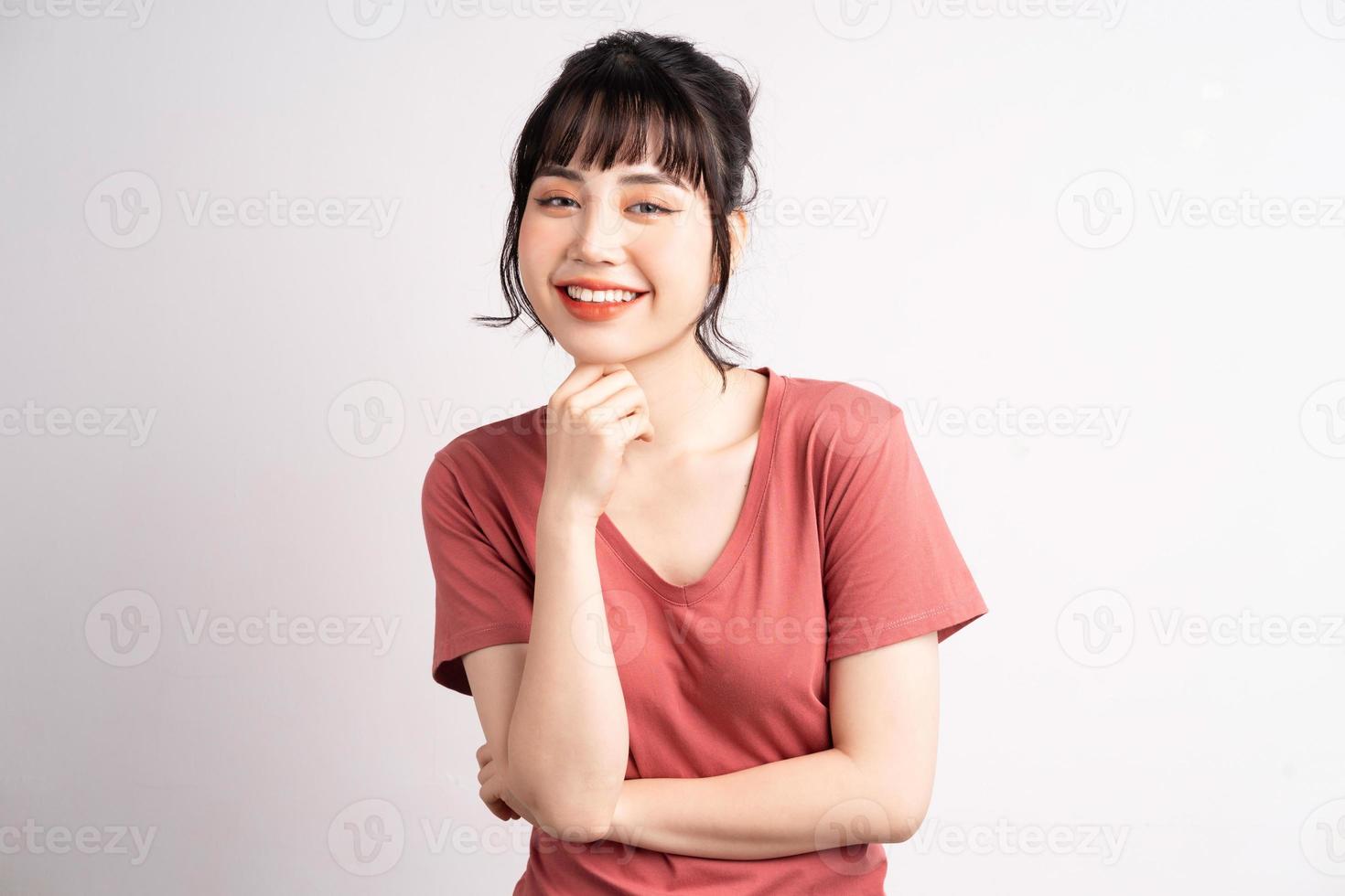 Young Asian woman posing on white background photo