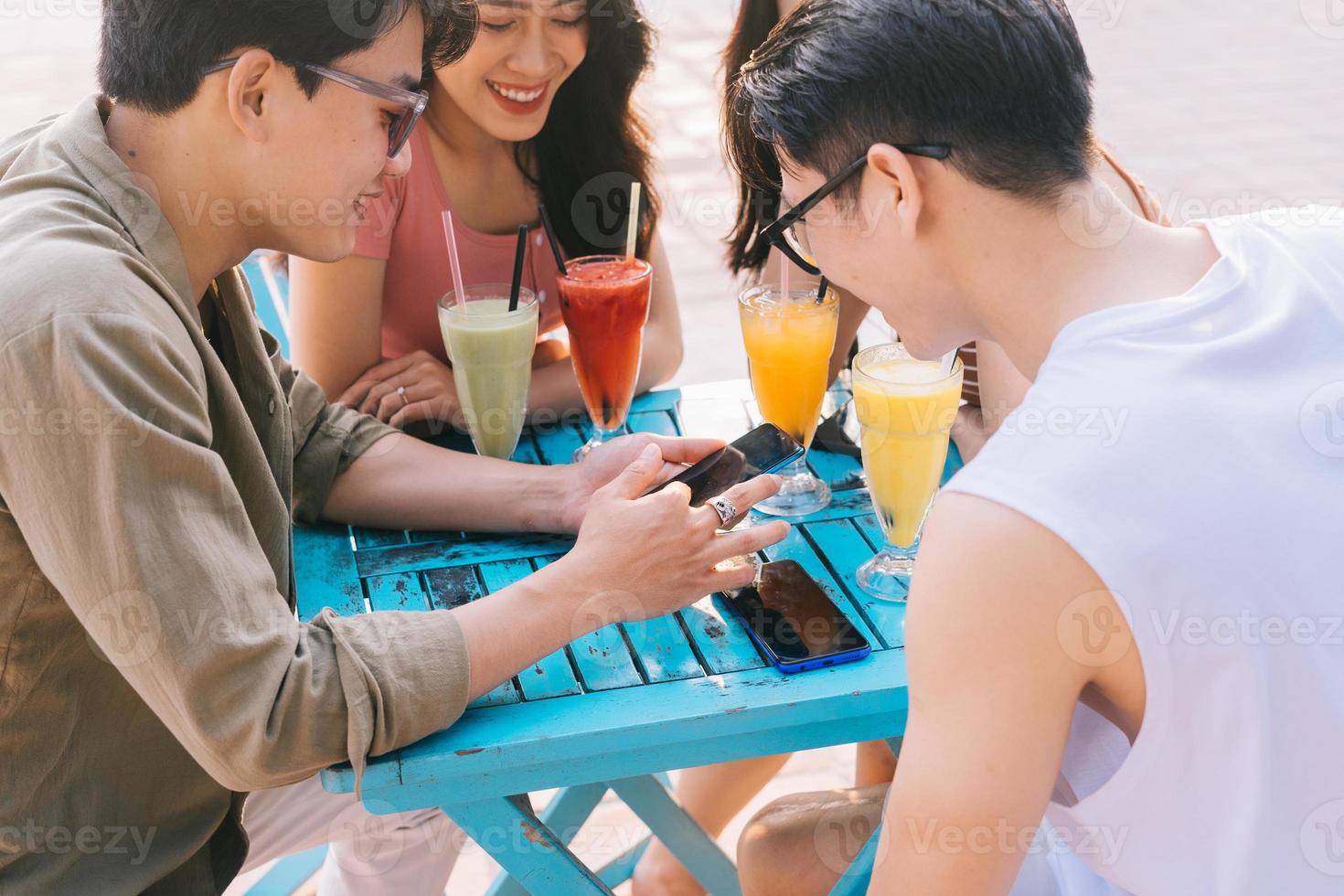 A group of young Asians enjoy a trip to the sea on a summer vacation photo