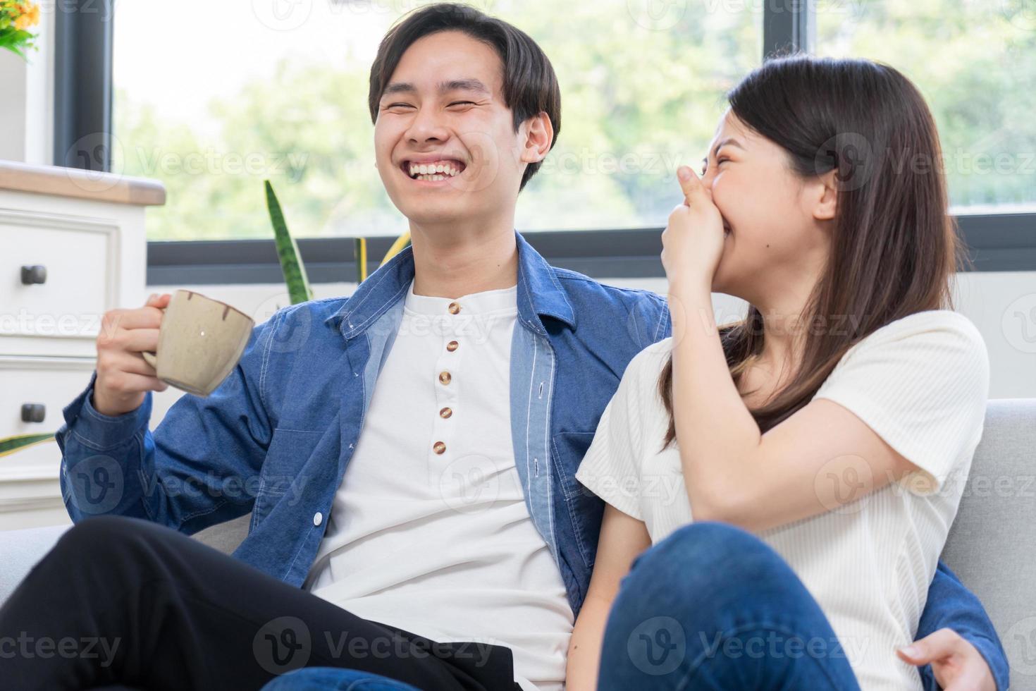 Young Asian couple chatting happily photo