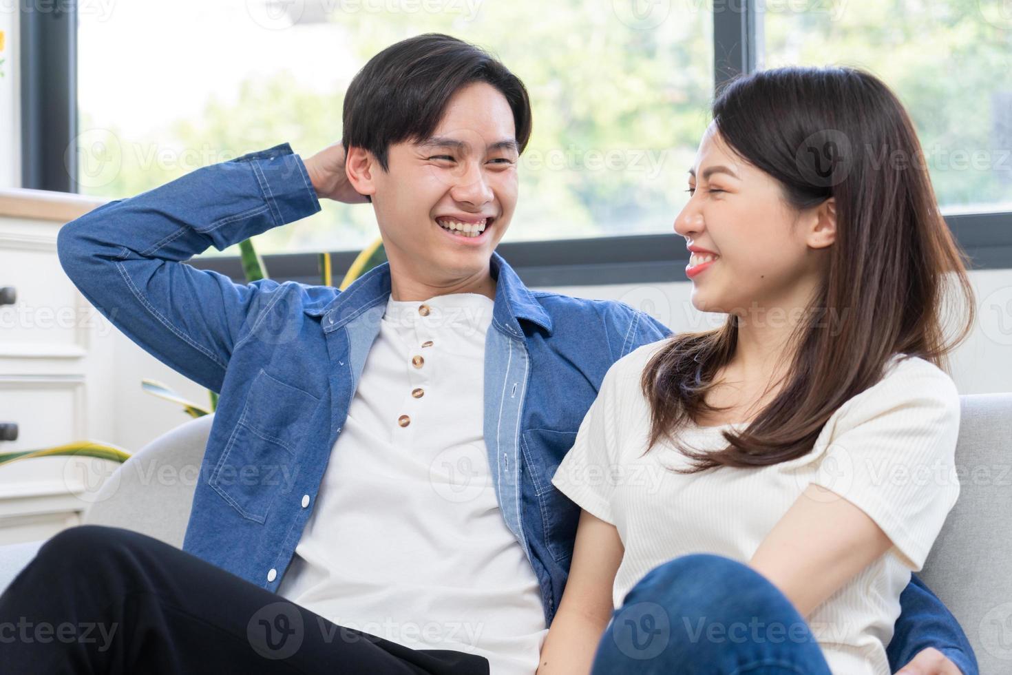 Young Asian couple chatting happily photo