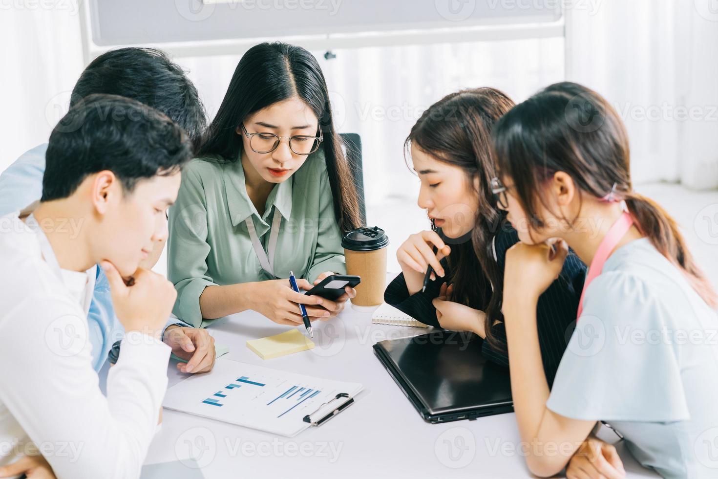 The business team members are discussing next month's plans together photo