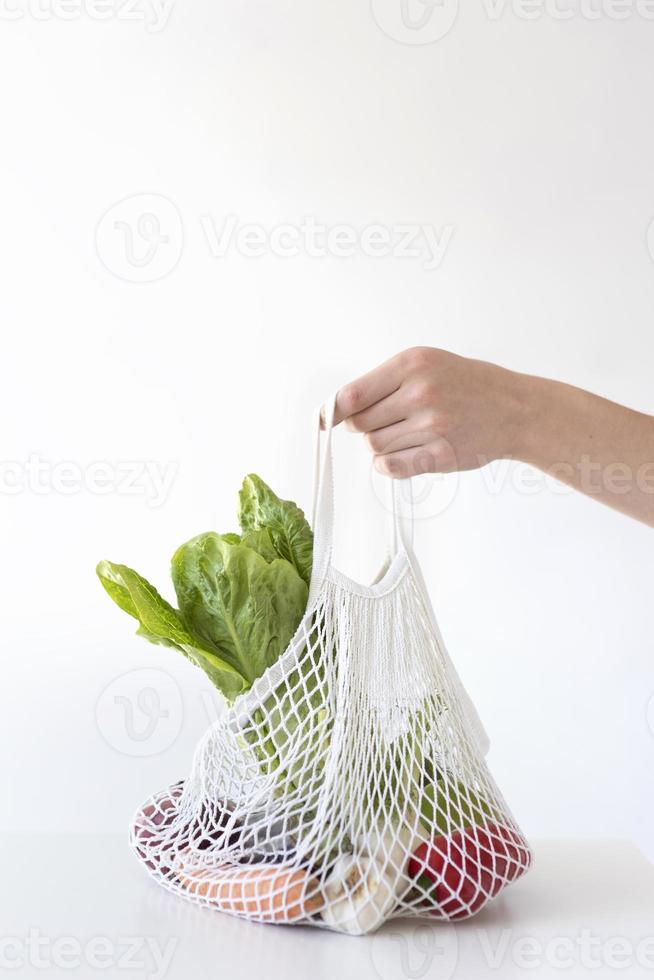 Vegetables arrangement in a textile bag photo