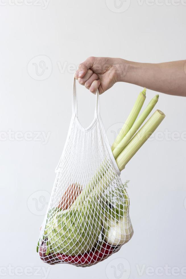 Vegetables arrangement in a textile bag photo