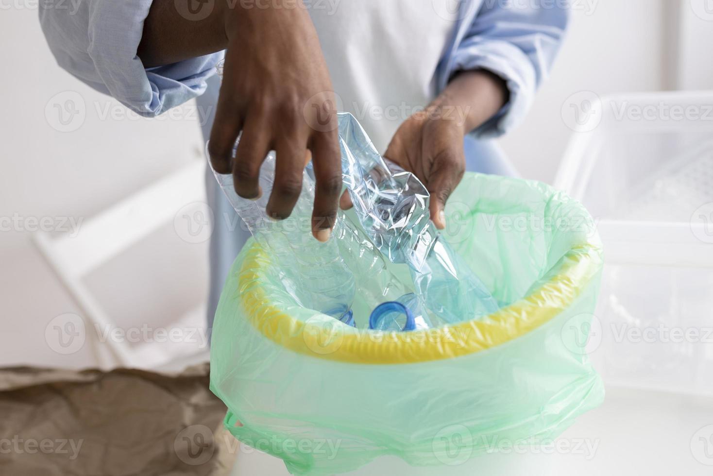 Young woman recycling for a better environment photo