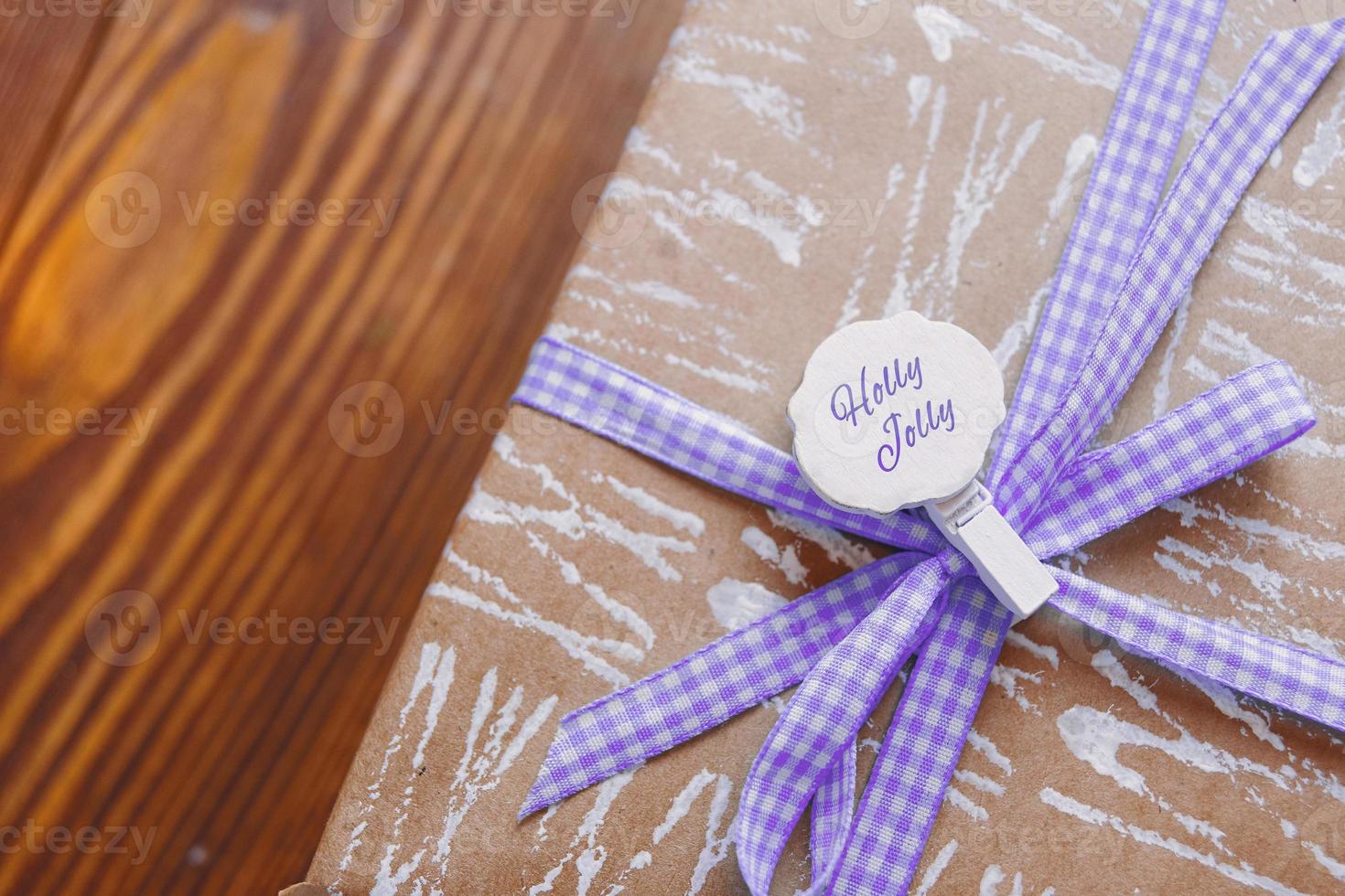 Gift box on wooden table. photo