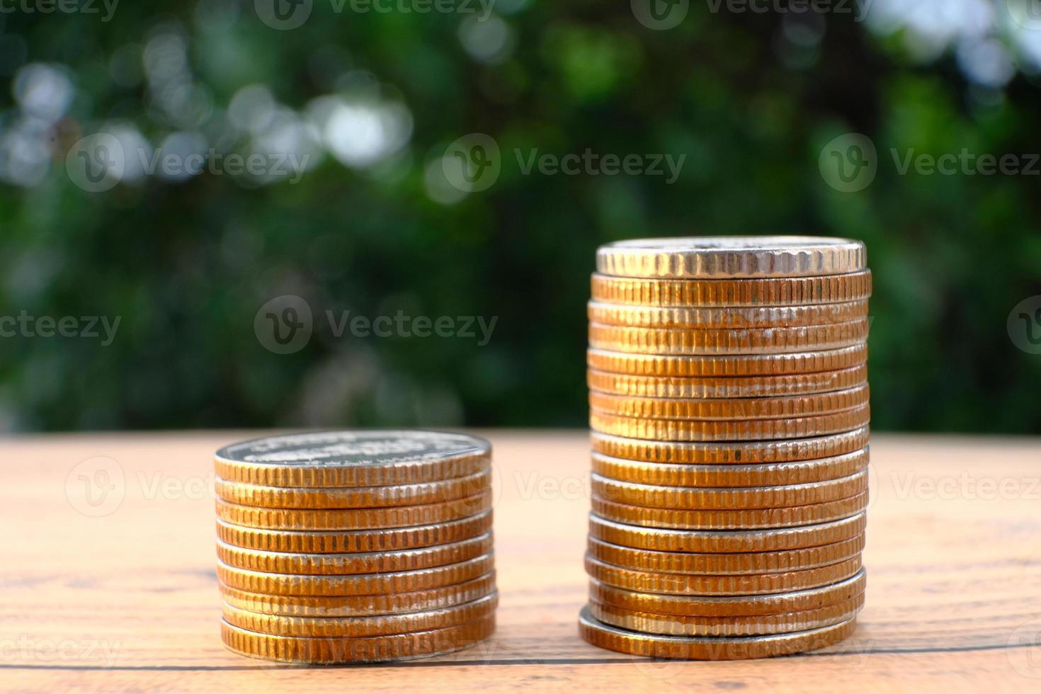 coins on table background and saving money and business growth concept,finance and investment concept, invest it to make it grow even more, Growth money of profitability of professional investment photo