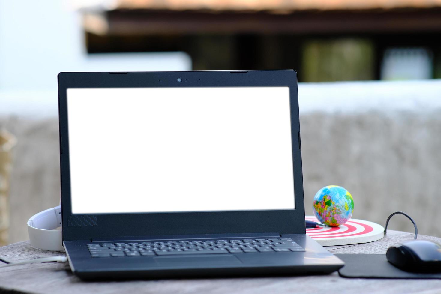 Laptop computer working space with office equipment photo