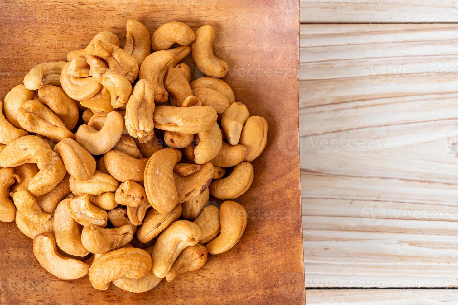 Cashew nuts in wooden bowl photo