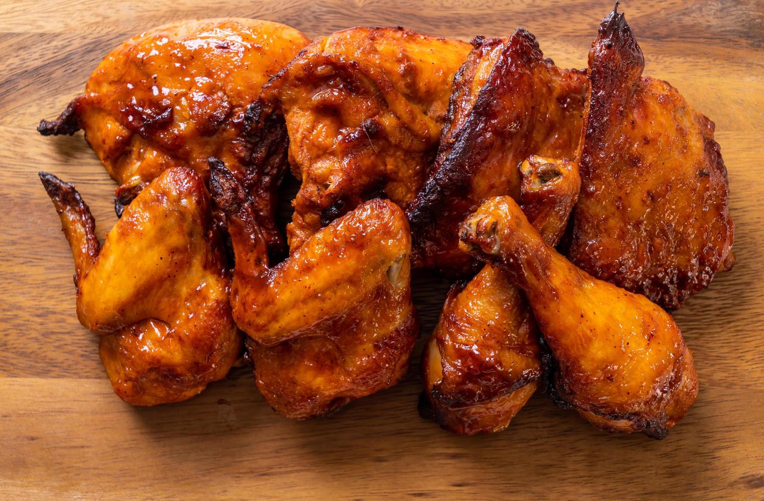 Grilled and barbecue chicken on a table photo