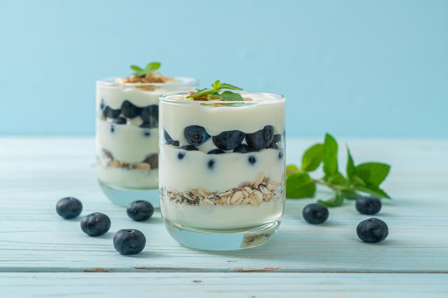 Fresh blueberries and yogurt with granola - Healthy food style photo