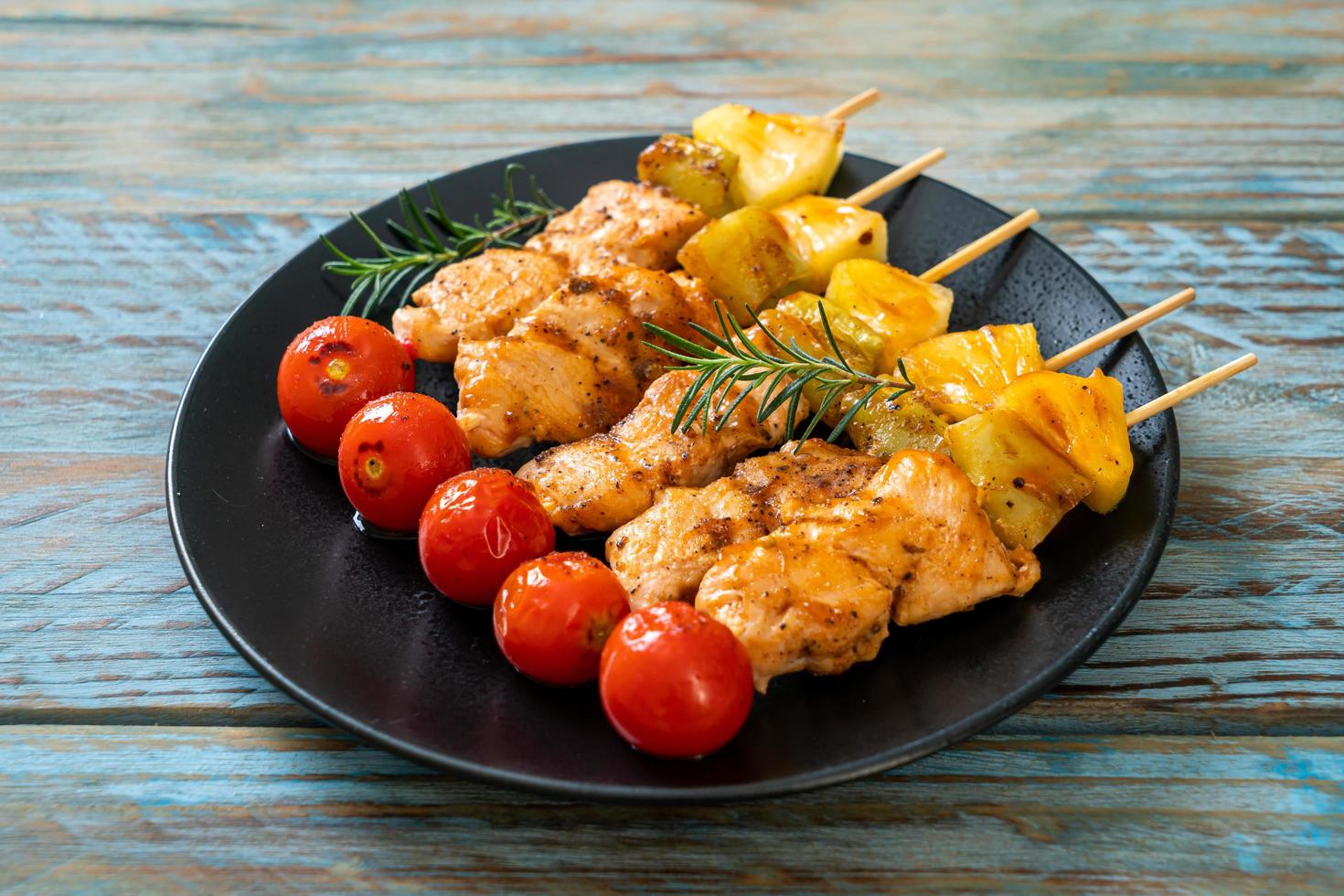 Grilled chicken barbecue skewer on plate photo