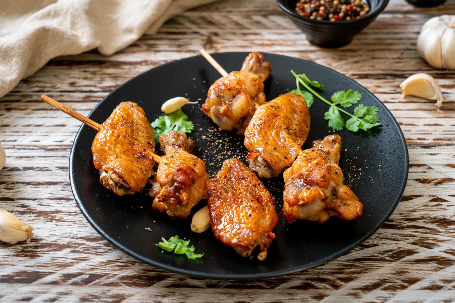 Grilled chicken wings barbecue with pepper and garlic photo