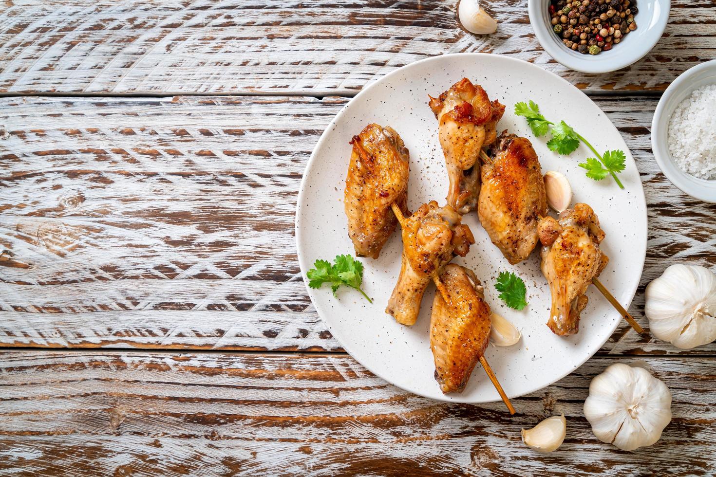 Grilled chicken wings barbecue with pepper and garlic photo