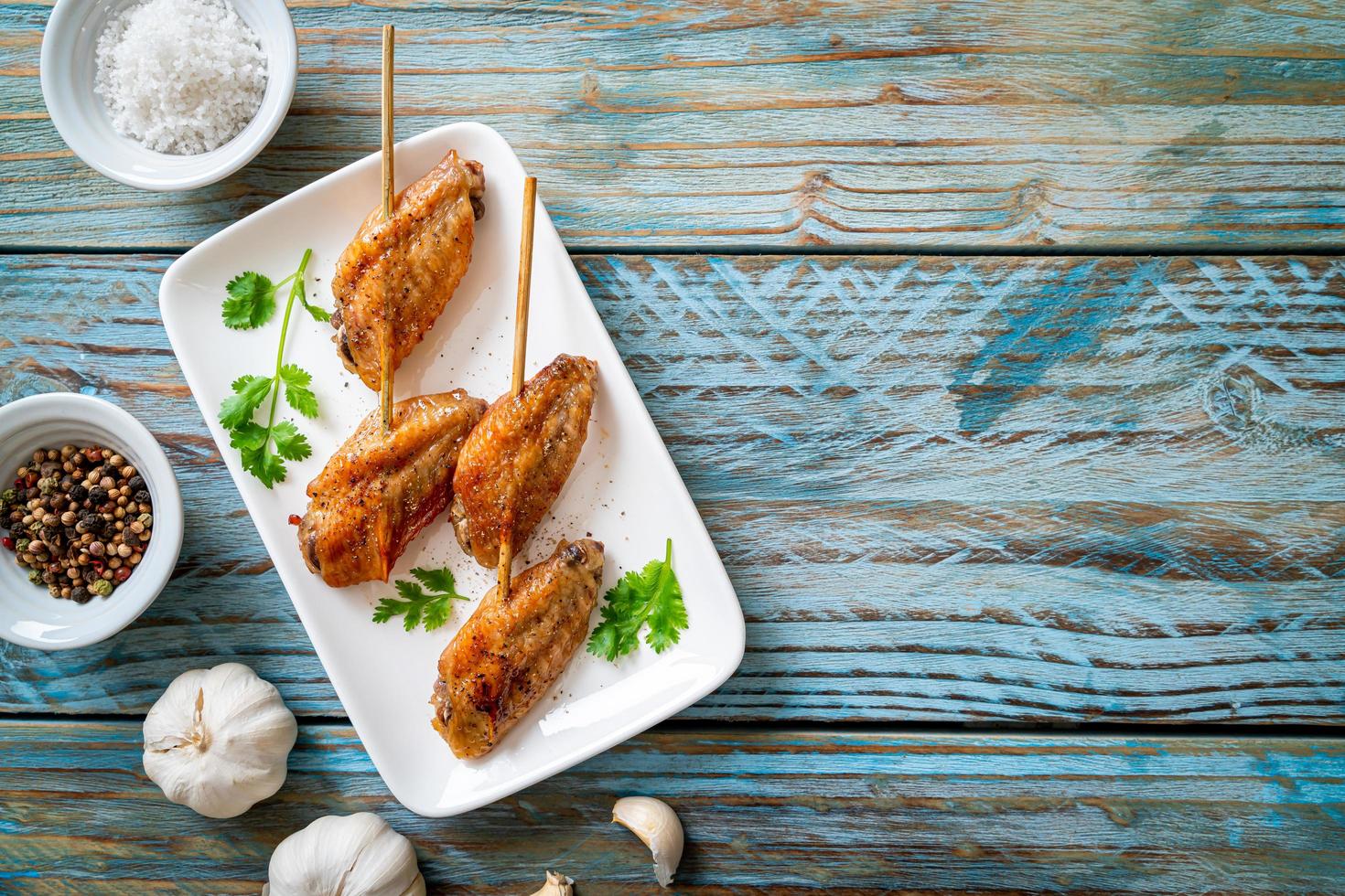 Grilled chicken wings barbecue with pepper and garlic photo