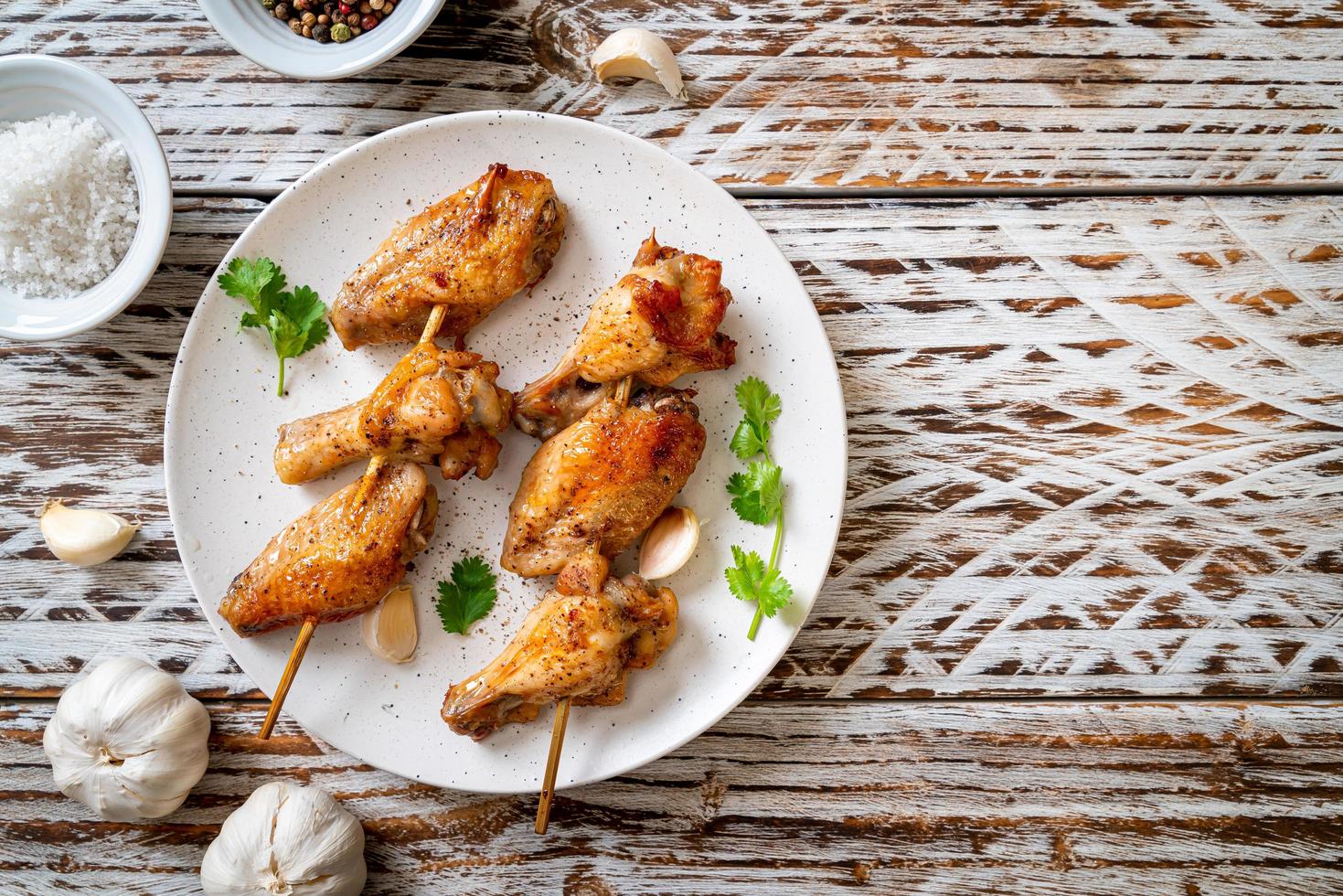 Grilled chicken wings barbecue with pepper and garlic photo