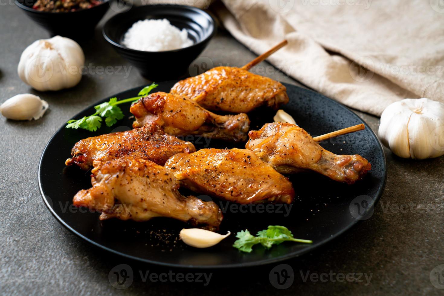 Grilled chicken wings barbecue with pepper and garlic photo