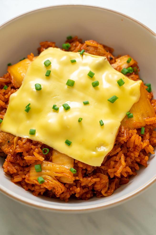 Kimchi fried rice with pork and topped cheese - Asian and fusion food style photo