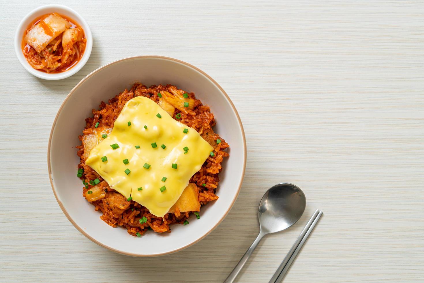 Kimchi fried rice with pork and topped cheese - Asian and fusion food style photo