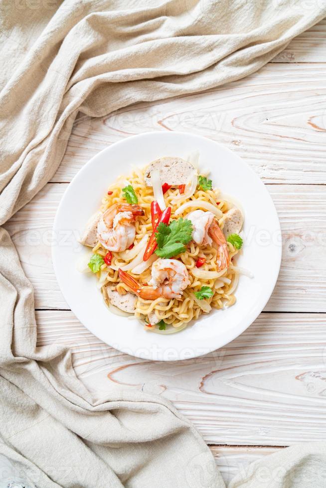 Spicy instant noodles salad with shrimps - Thai food style photo