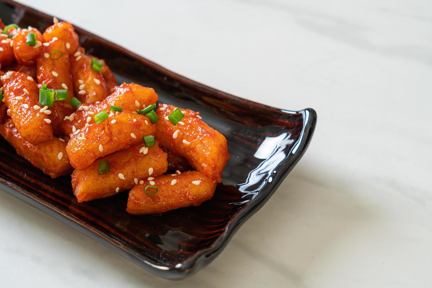 Deep-fried Korean rice cake, or Tteokbokki, with spicy sauce - Korean food style photo