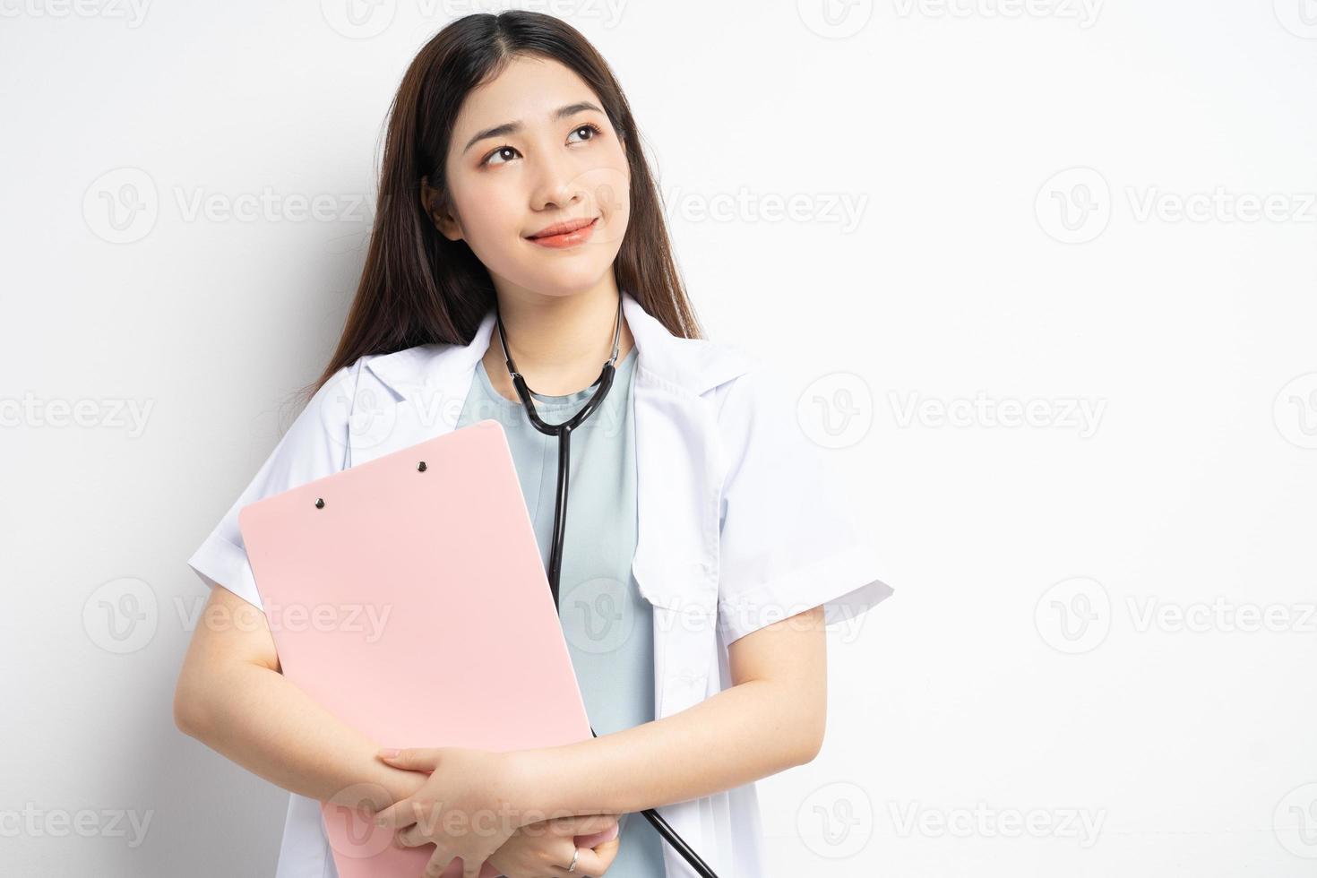 Female doctor holding document photo