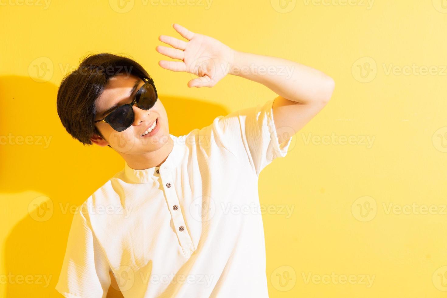 Asian man on a yellow background photo