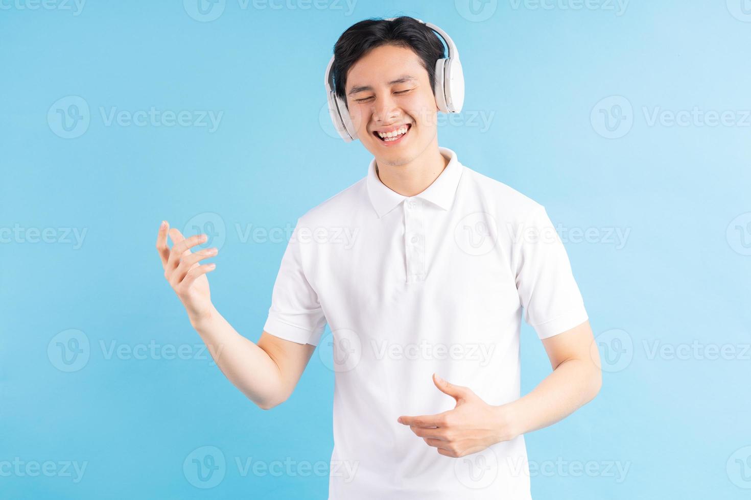 Asian man listening to music photo