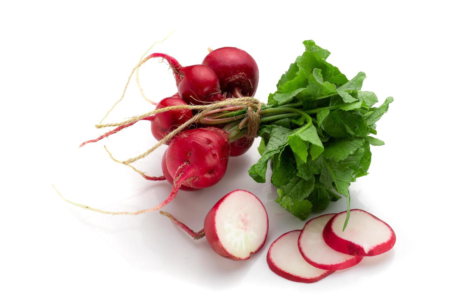 Freshly ripe radishes isolated on white background photo