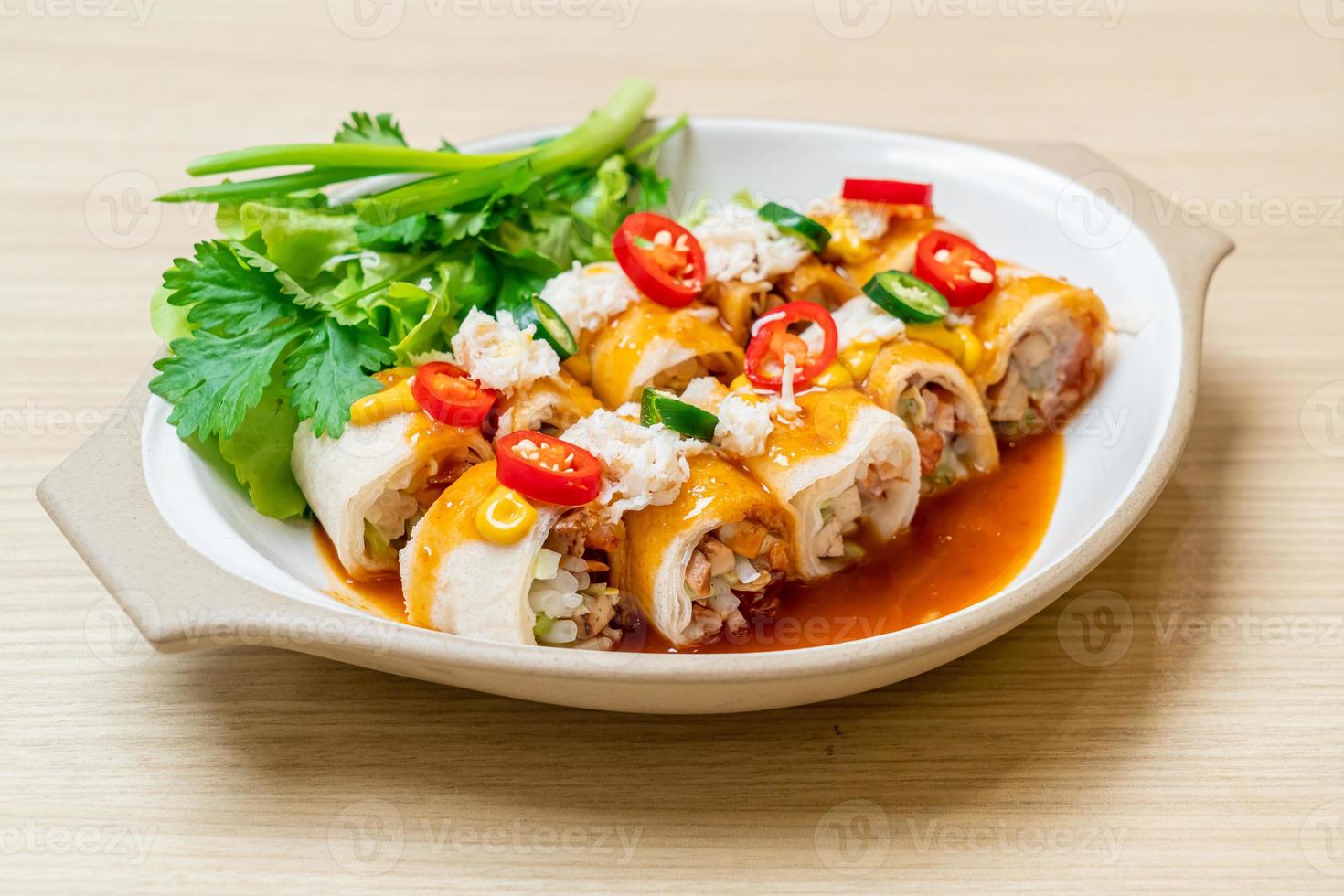 Fresh spring rolls with crab and sauce and vegetables - healthy food style photo