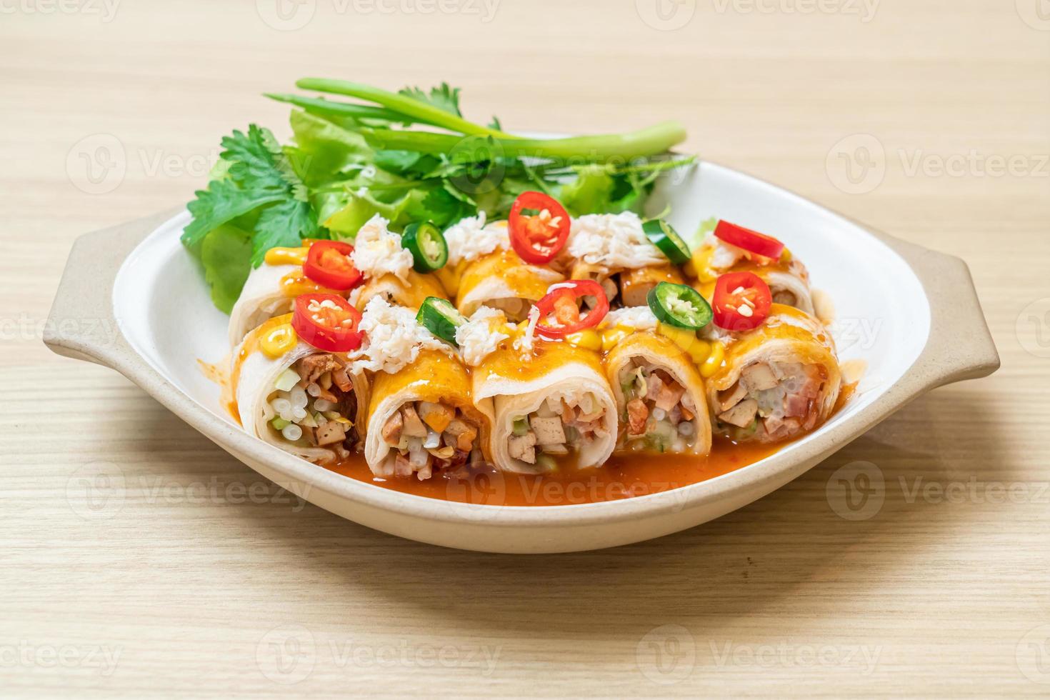 Fresh spring rolls with crab and sauce and vegetables - healthy food style photo