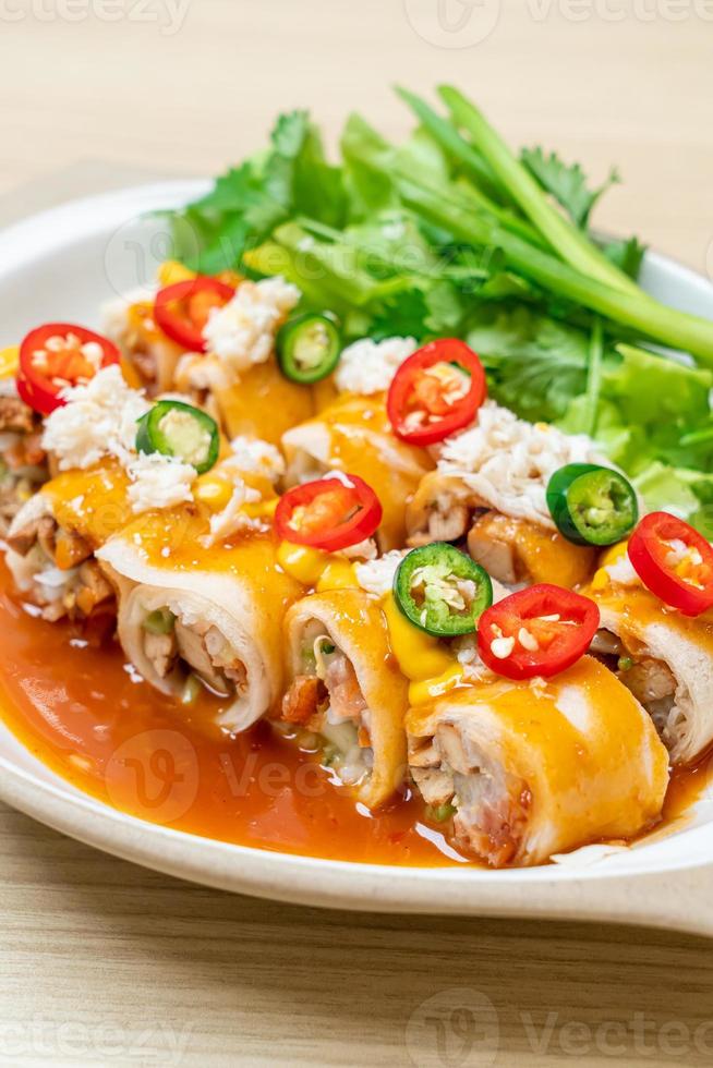 Fresh spring rolls with crab and sauce and vegetables - healthy food style photo