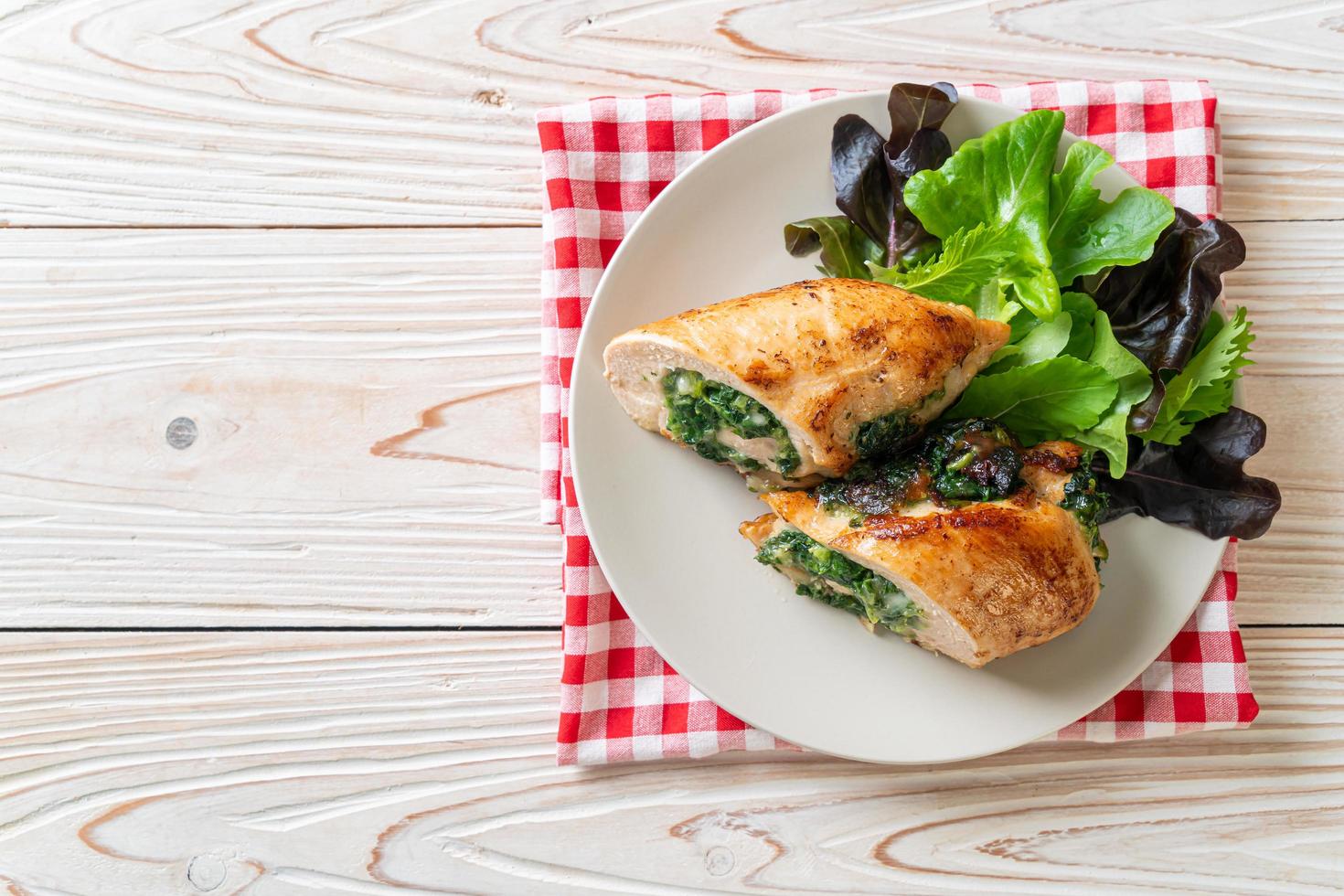 Chicken breast stuffed with cheese and spinach photo