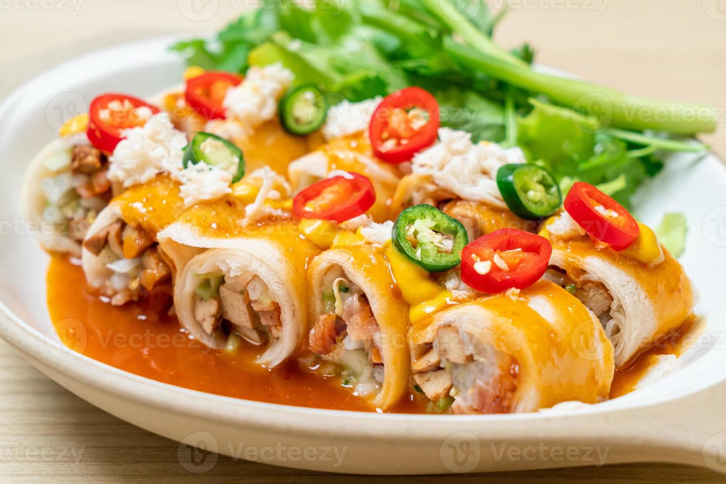 Fresh spring rolls with crab and sauce and vegetables - healthy food style photo
