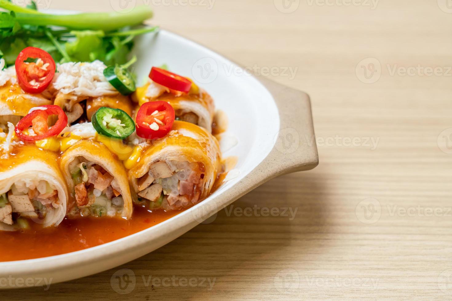 Fresh spring rolls with crab and sauce and vegetables - healthy food style photo