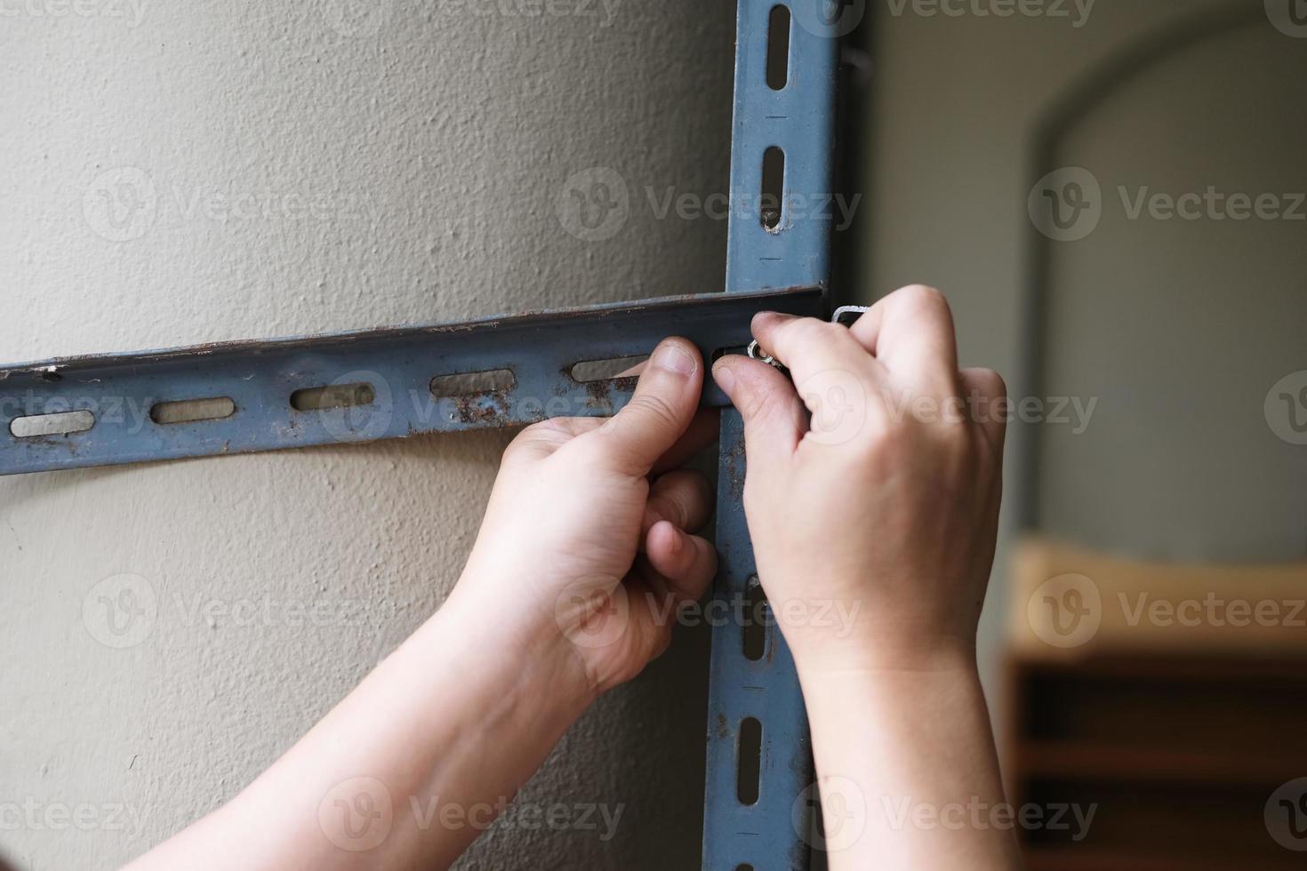 do it yourself concept, Craftsmen to assemble old iron parts. Make a shelf on your free weekend photo