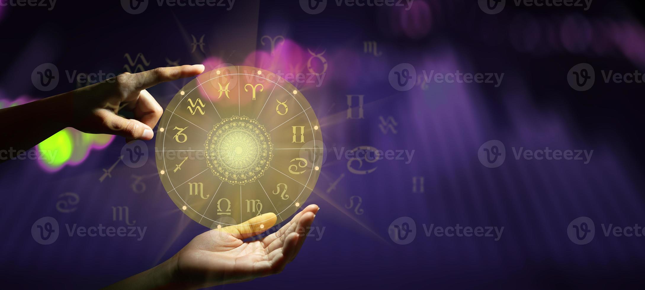 Zodiac sign wheel of fortune hologram with mandala inside photo