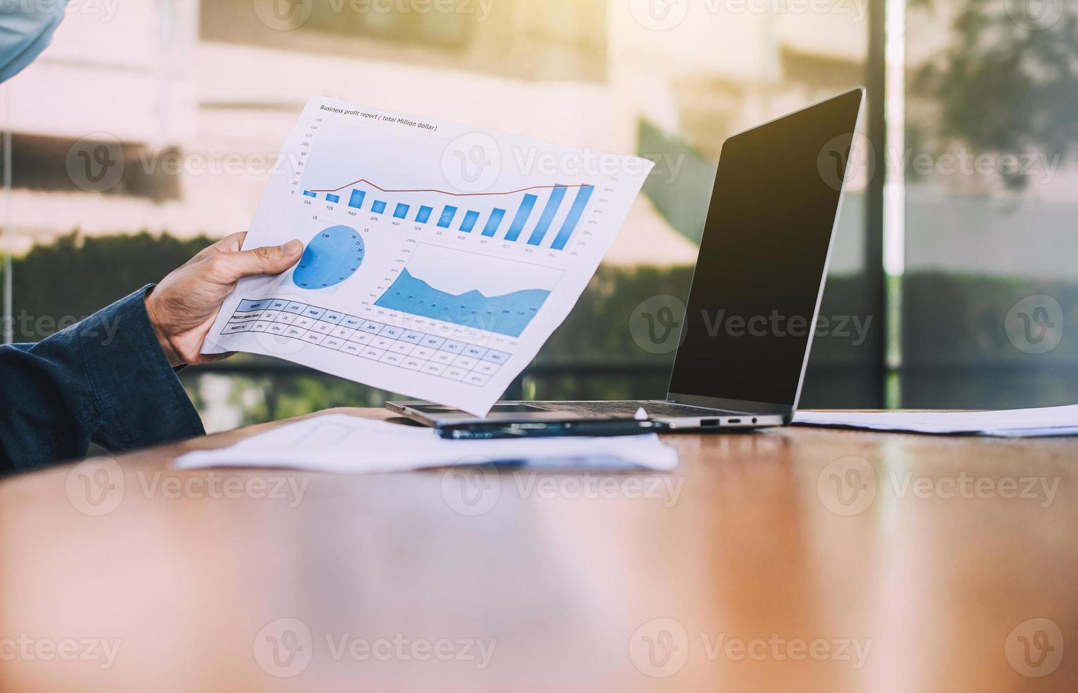 Man worker working business report on computer in office photo