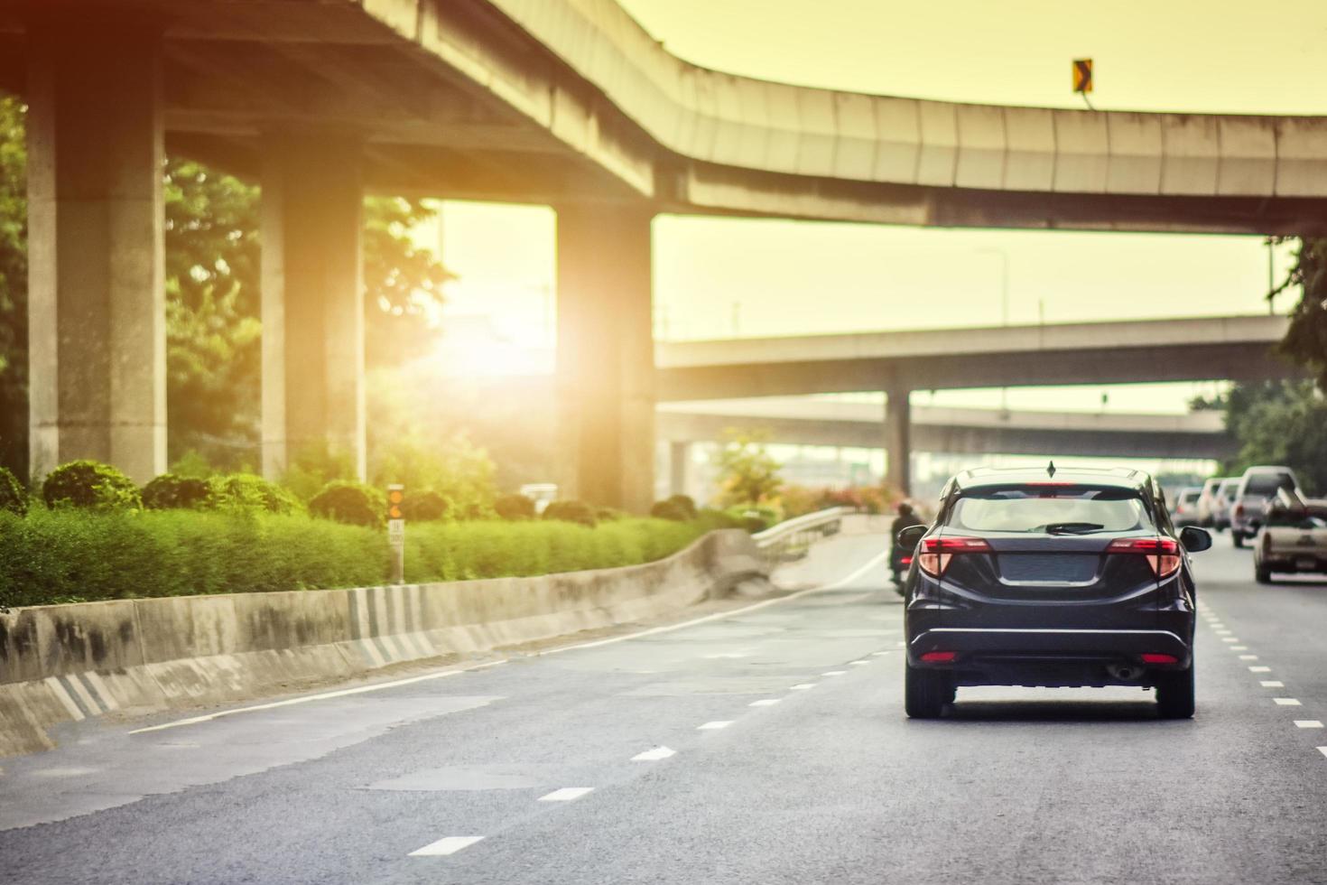 Car driving on road and Small passenger car seat on the road used for daily trips photo