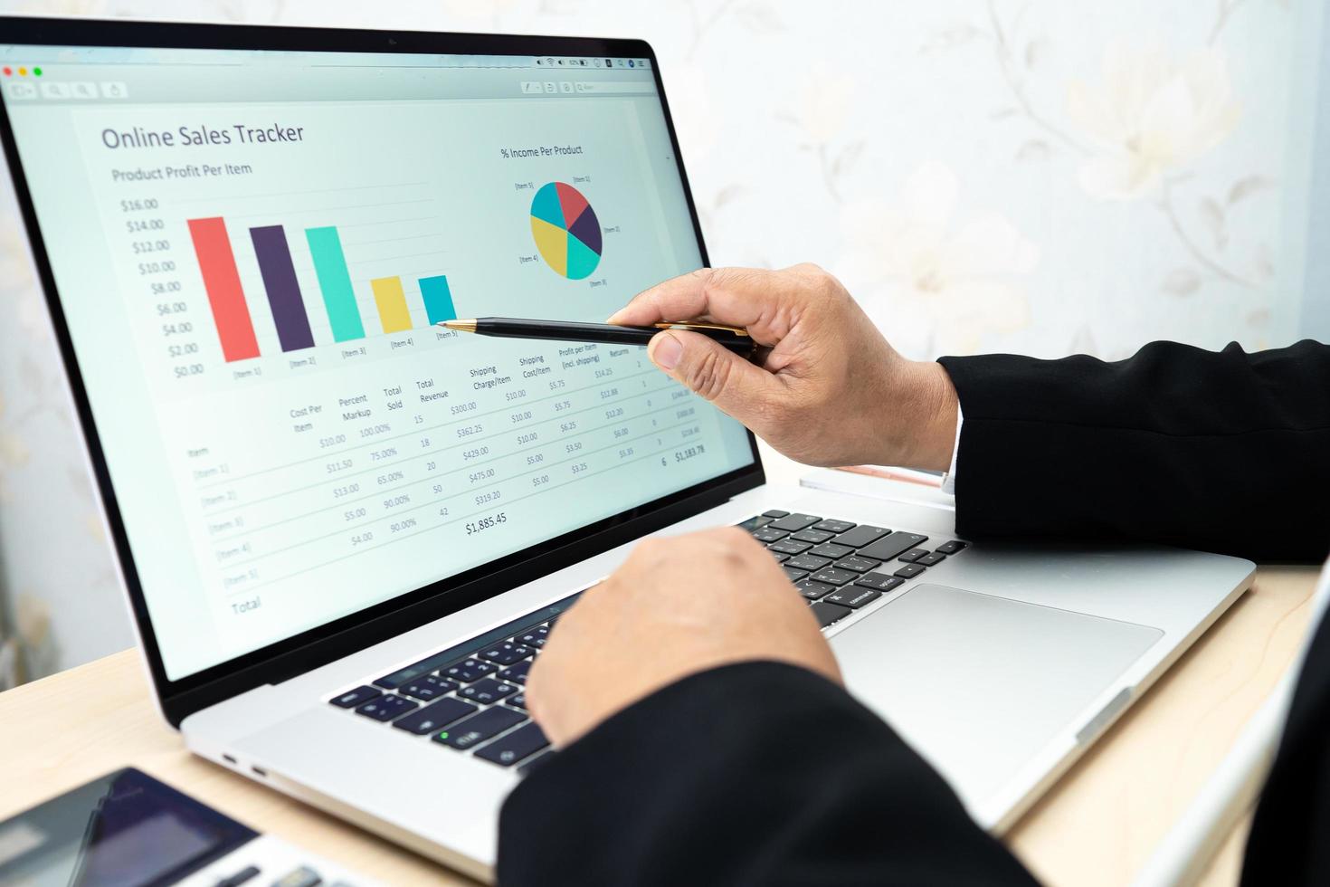 Asian accountant working and analyzing financial reports project accounting with chart graph and calculator in modern office, finance and business concept. photo