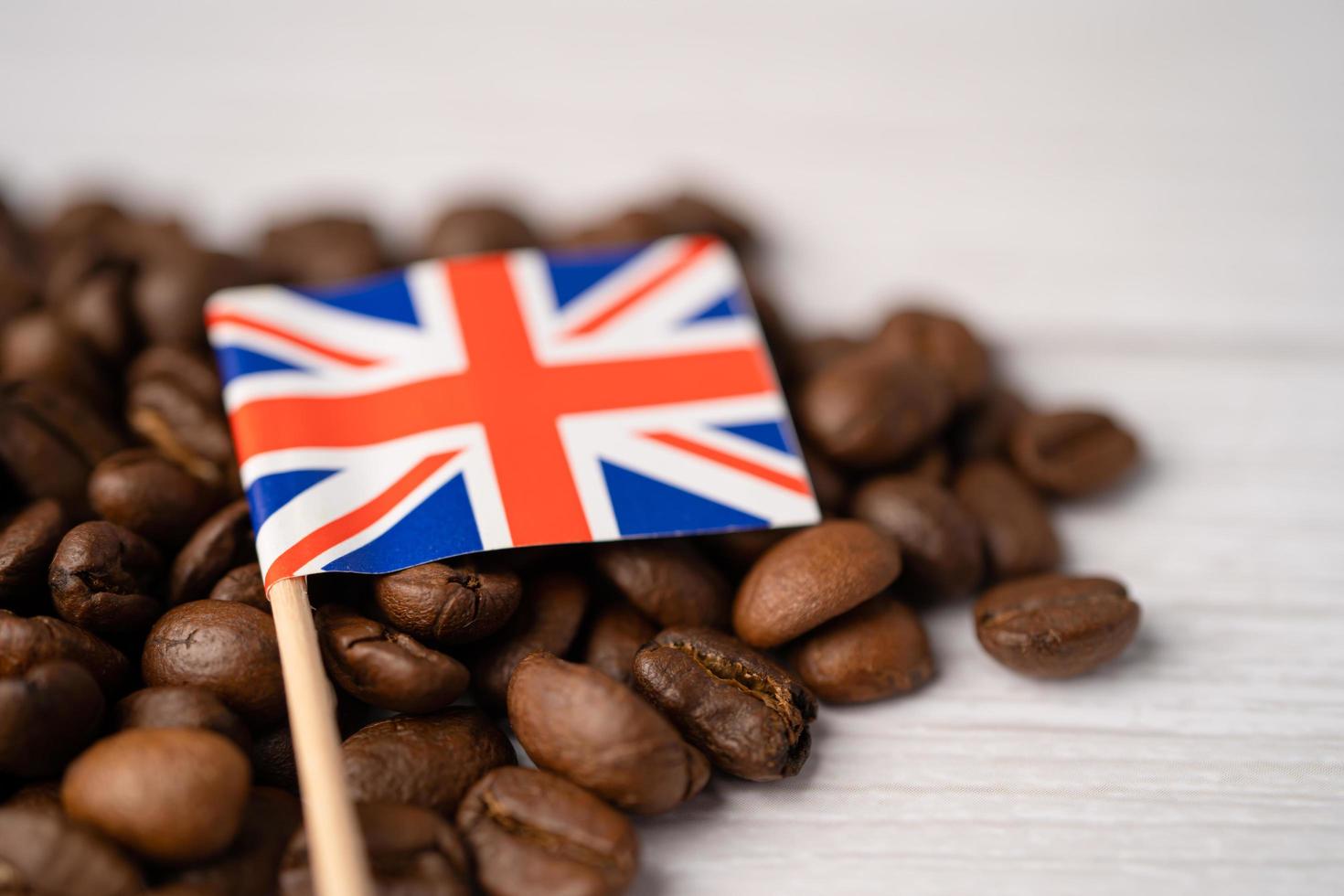 United Kingdom flag on coffee beans. Import-export drink food concept. photo