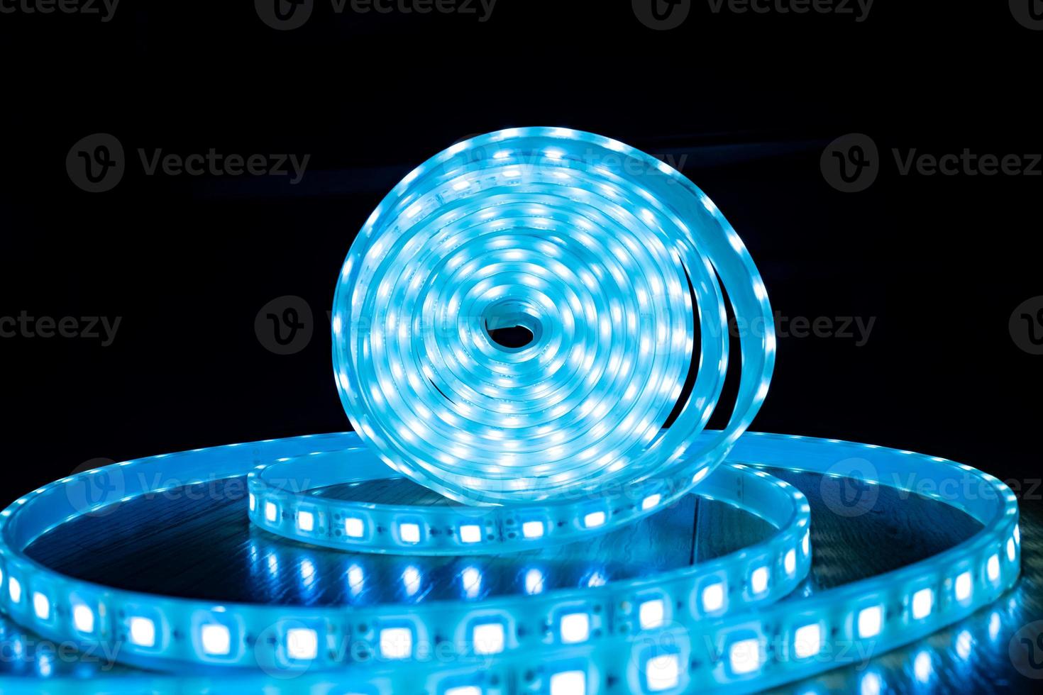 babin of glowing decorative LED strip of blue cold color on a black background photo