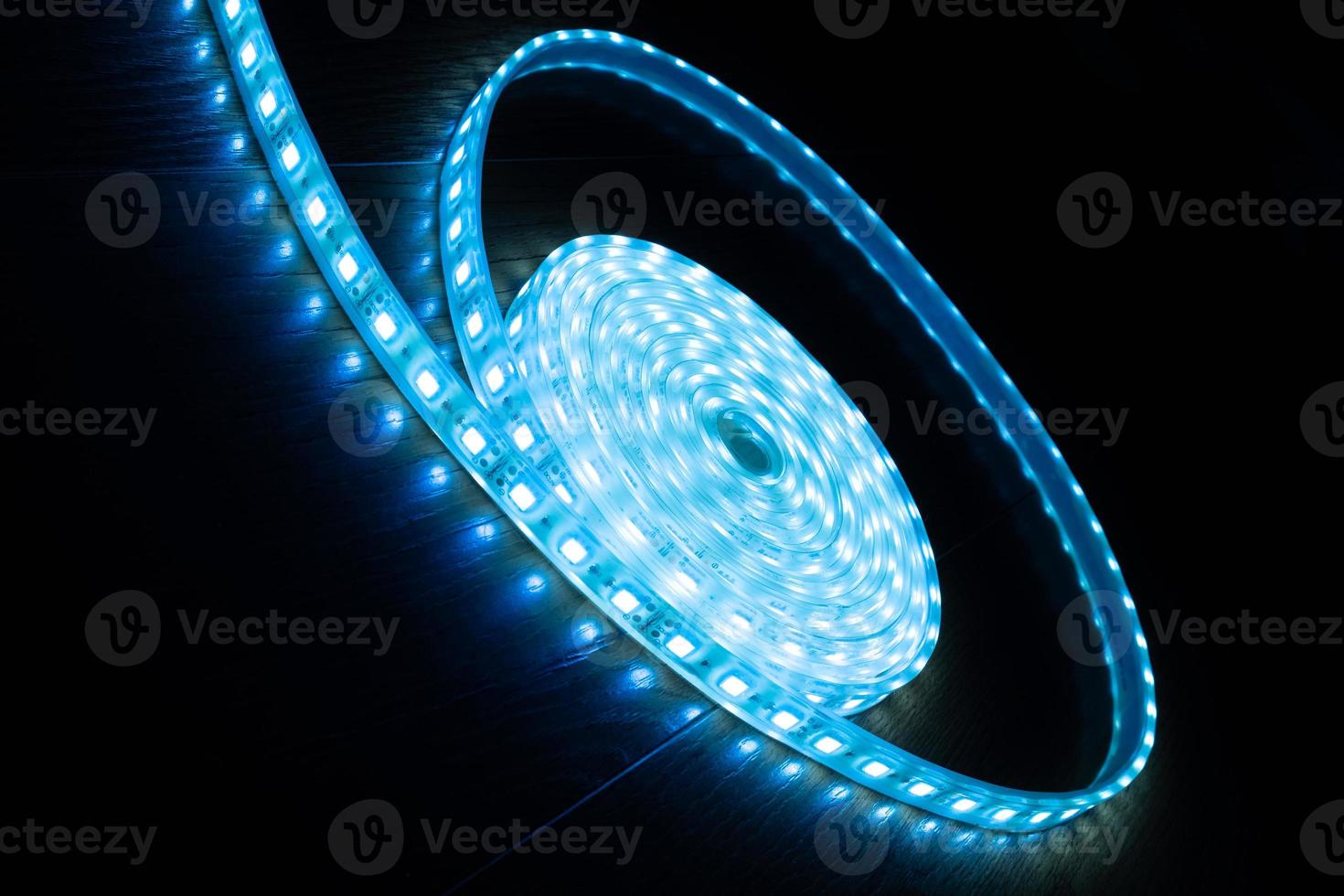 a skein of blue LED strip on a black background photo