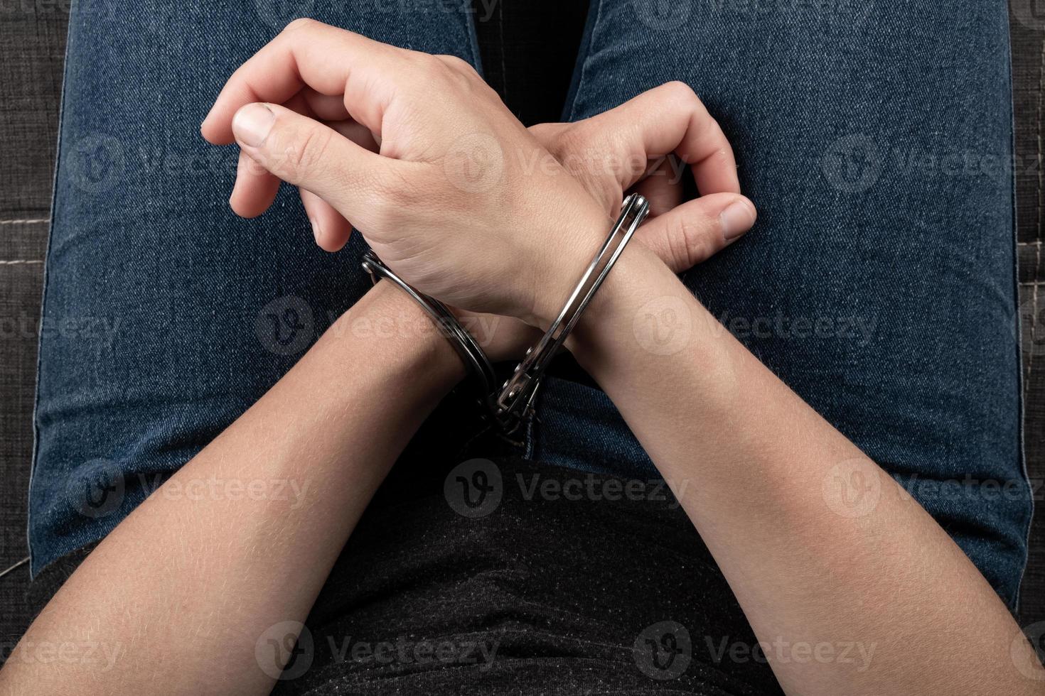 woman hands in  handcuffs , detention in a crime photo