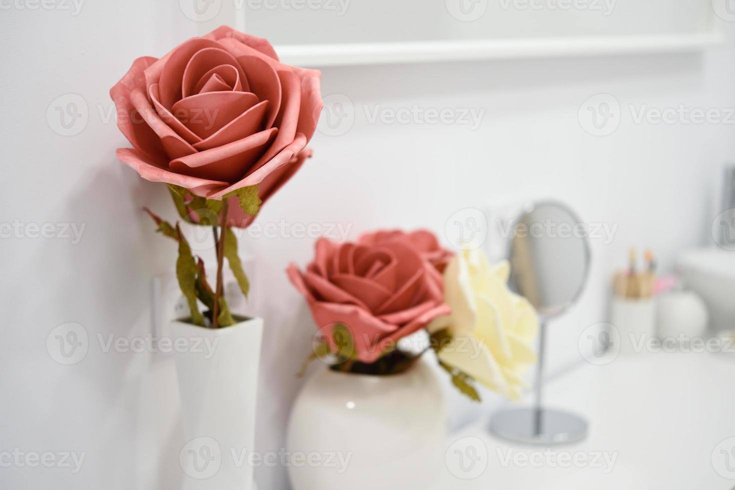 Decoration details in modern wellness center with flower vase and candles. photo